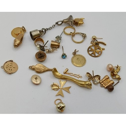 1781 - A 9ct gold chain, and assorted gold, yellow metal and silver charms