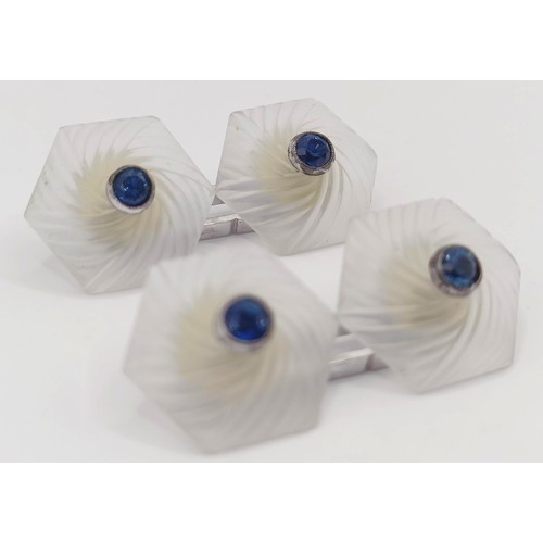 1783 - A pair of carved moonstone and sapphire cufflinks