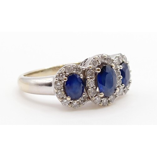 1785 - An 18ct gold, sapphire and diamond three stone ring, ring size J