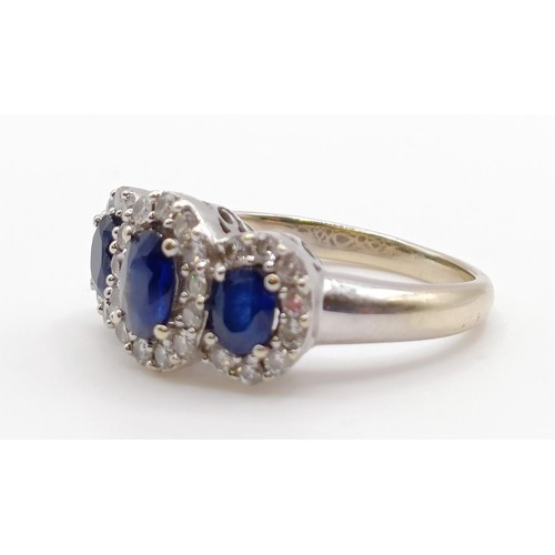 1785 - An 18ct gold, sapphire and diamond three stone ring, ring size J