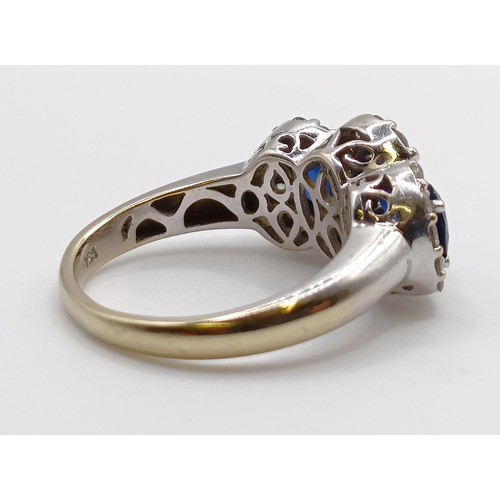 1785 - An 18ct gold, sapphire and diamond three stone ring, ring size J