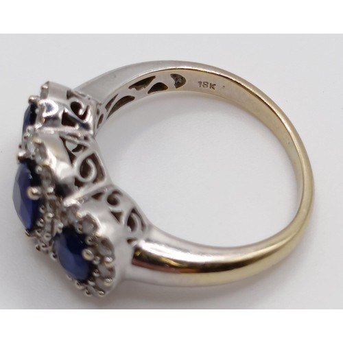 1785 - An 18ct gold, sapphire and diamond three stone ring, ring size J