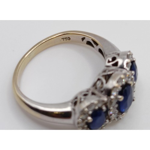 1785 - An 18ct gold, sapphire and diamond three stone ring, ring size J