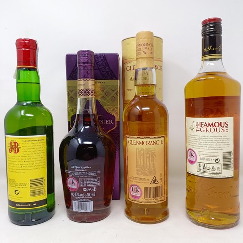 1540 - A litre bottle of Famous Grouse whisky, a bottle of J & B Rare whisky, a bottle of Glenmorangie,... 