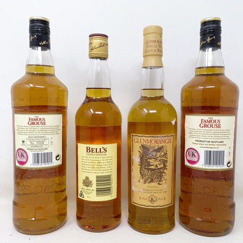 1553 - Two litre bottles of Famous Grouse whisky, a bottle of Glenmorangie 10 year old single malt whisky, ... 