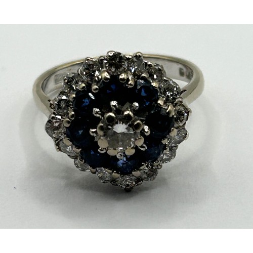 1663 - An 18ct gold, diamond and sapphire cluster ring, ring size M 1/2