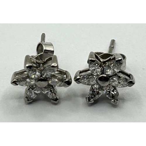 1667 - A pair of 18ct white gold and diamond snowflake earrings