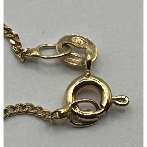 1670 - A 9ct gold and diamond oval pendant, on a chain