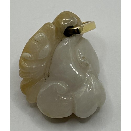 1676 - A carved white stone pendant