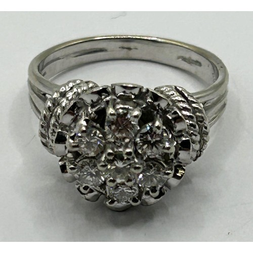 1685 - An 18ct white gold and diamond cluster ring, ring size K