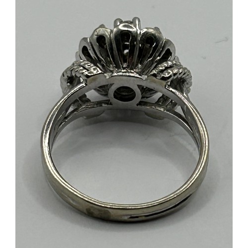 1685 - An 18ct white gold and diamond cluster ring, ring size K