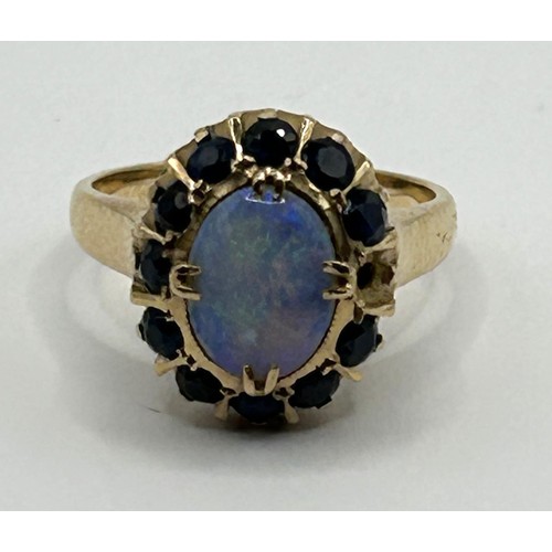 1691 - An 18ct gold, opal and blue stone ring, ring size J