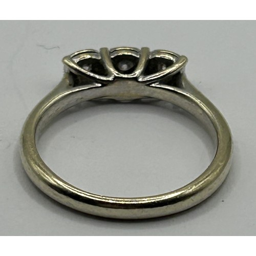 1735 - A 9ct gold and three stone diamond ring, ring size K 1/2