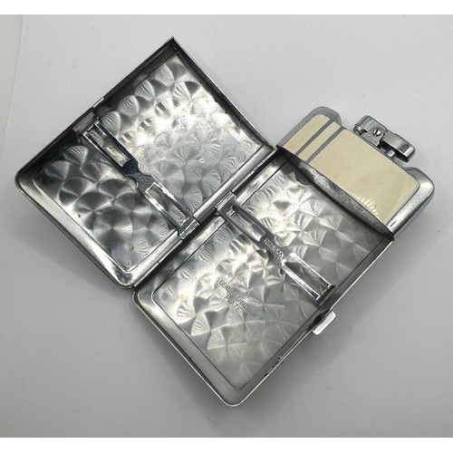 1755 - An Art Deco combination cigarette case and lighter, 11 cm high