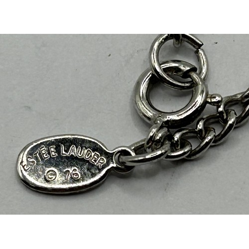 1764 - An Estee Lauder scent bottle, on chain