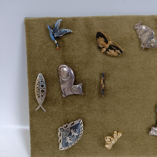 1793 - A collection of mainly silver naturalistic brooches and earrings to include Trifari and cat subjects