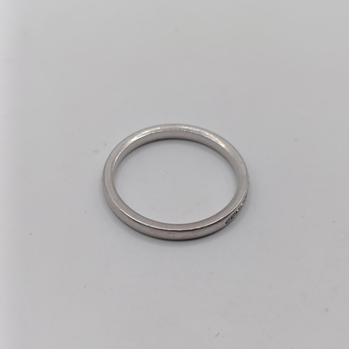 1695 - A platinum and diamond half hoop ring, ring size M