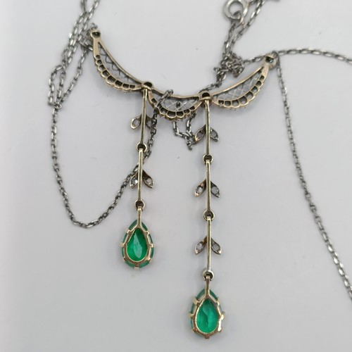 1662 - An Edwardian white and yellow coloured metal, diamond and emerald necklace, having a lattice design,... 