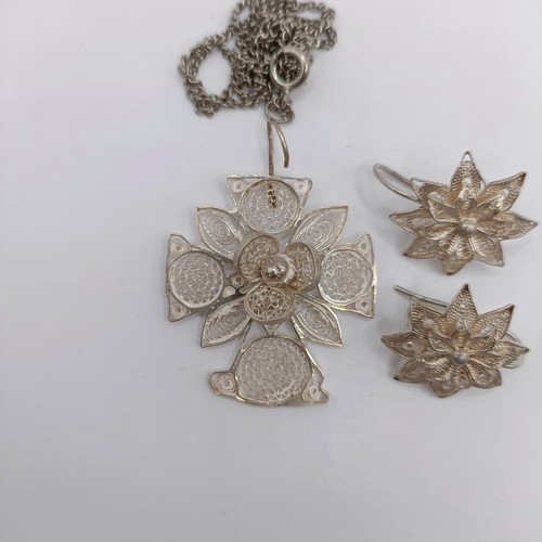 1660 - A silver filigree pendant, and a pair of similar earrings