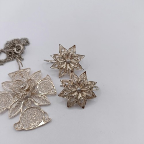 1660 - A silver filigree pendant, and a pair of similar earrings