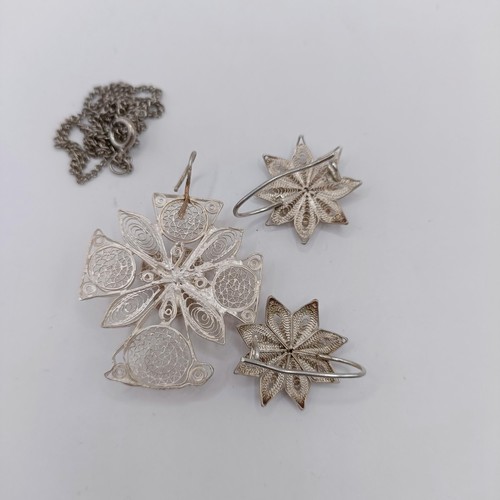 1660 - A silver filigree pendant, and a pair of similar earrings