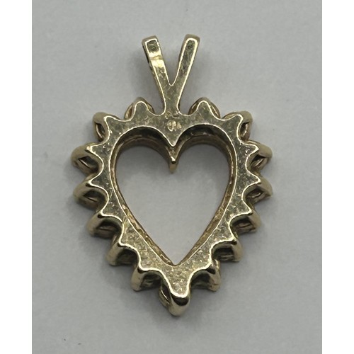 1620 - A 14ct gold and diamond heart shaped pendant