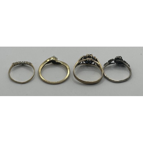 1633 - A 9ct gold gem set ring, and three other rings (4)