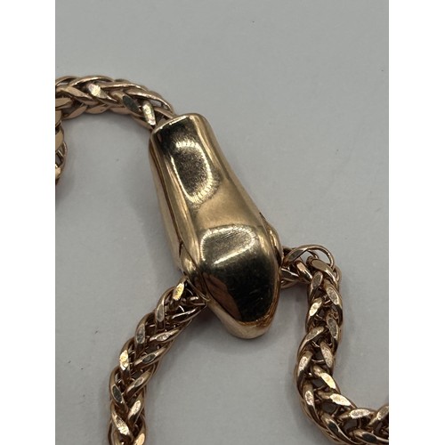 1635 - A 9ct gold snake necklace, 9.3 g