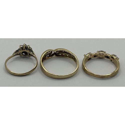 1654 - A 9ct gold and white stone ring, ring size O, and two other gem set rings (3)