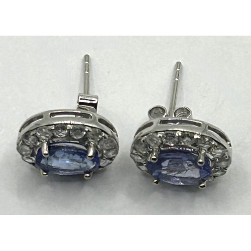 1659 - A pair of topaz and diamond cluster earrings