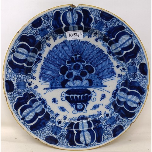 1054 - A pair of Dutch Delft blue and white plates, decorated flowers, 32 cm diameter, and another pair (4)