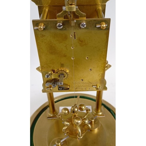 1213 - A brass 400 day anniversary clock, under a glass dome, 30 cm high