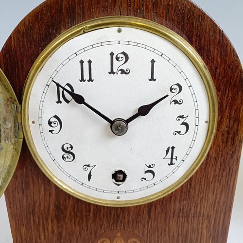 1214 - An Edwardian mantel clock, in an inlaid mahogany case, 21.5 cm high, and two others similar (3)