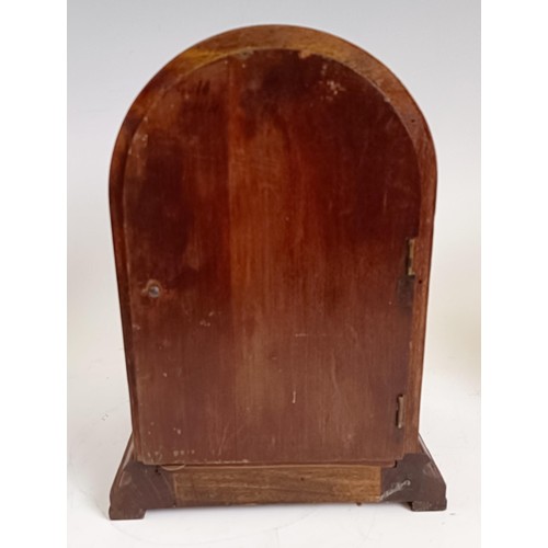 1214 - An Edwardian mantel clock, in an inlaid mahogany case, 21.5 cm high, and two others similar (3)