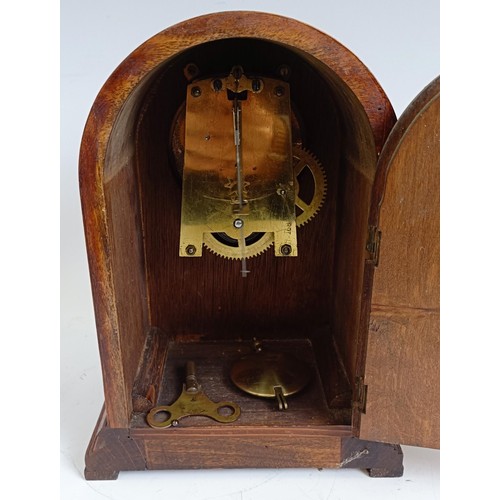 1214 - An Edwardian mantel clock, in an inlaid mahogany case, 21.5 cm high, and two others similar (3)