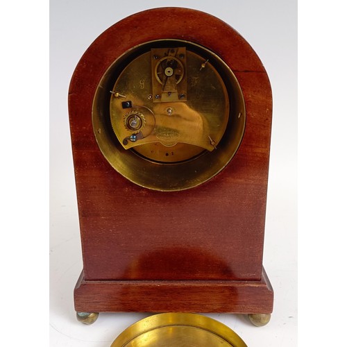 1214 - An Edwardian mantel clock, in an inlaid mahogany case, 21.5 cm high, and two others similar (3)