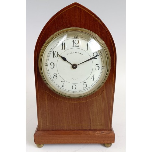 1214 - An Edwardian mantel clock, in an inlaid mahogany case, 21.5 cm high, and two others similar (3)