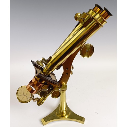 1216 - A late 19th century R & J Beck London & Philadelphia brass binocular microscope, with variou... 