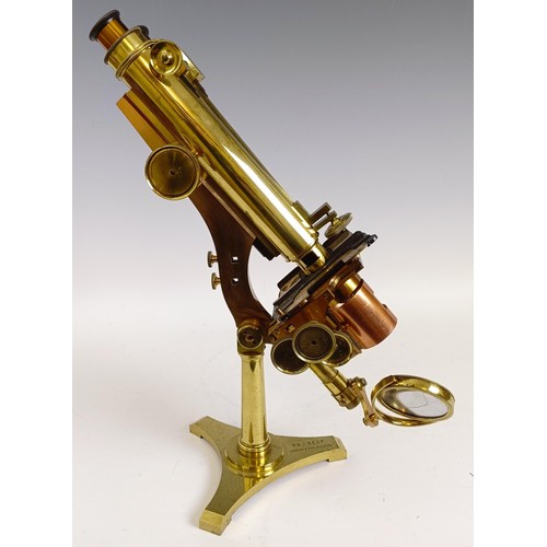 1216 - A late 19th century R & J Beck London & Philadelphia brass binocular microscope, with variou... 