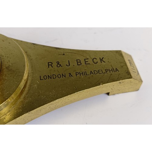 1216 - A late 19th century R & J Beck London & Philadelphia brass binocular microscope, with variou... 