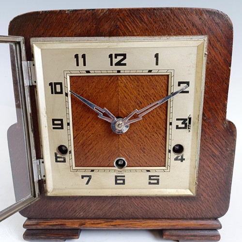 1219 - An Edwardian mantel clock, in a gilt metal and walnut case, 25 cm high, and two other clocks (3) Pro... 