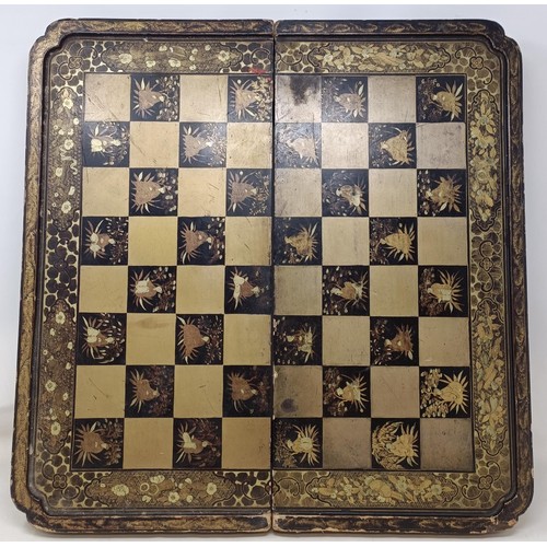 1090 - A Chinese black lacquered folding chess/backgammon board