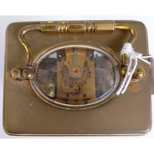 1218 - A carriage clock, with alarum, the enamel dial in a brass case, 15 cm high, in a leather travelling ... 