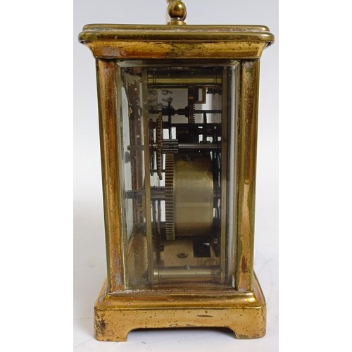 1218 - A carriage clock, with alarum, the enamel dial in a brass case, 15 cm high, in a leather travelling ... 