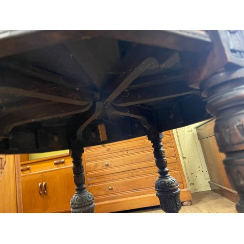 1271 - A late Victorian carved oak two tier table, 76 cm wide