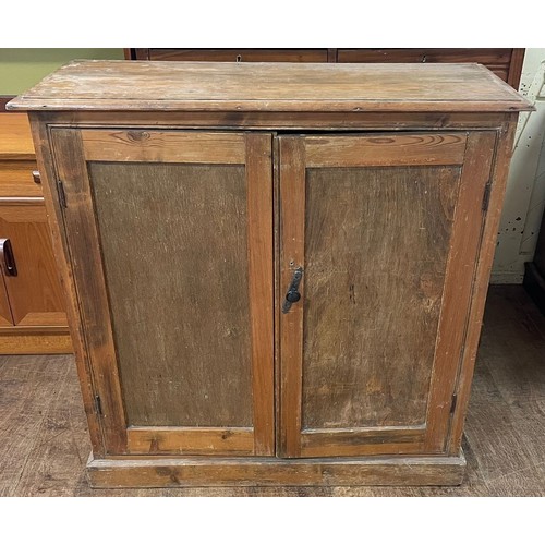 1255 - A pine chest, having two short and three long drawers, 108 cm wide, a pine cupboard, and two pine ch... 