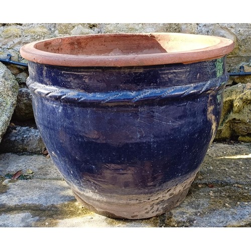 1430 - A blue glazed garden planter, and two wheelbarrows (3)