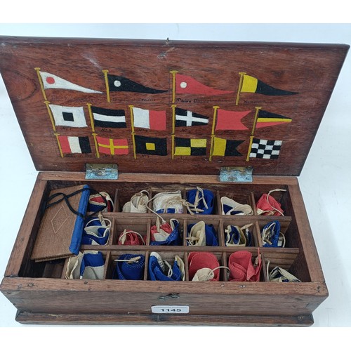 1145 - A box, the interior with divisions fitted with miniature flags, the underside of the box lid painted... 