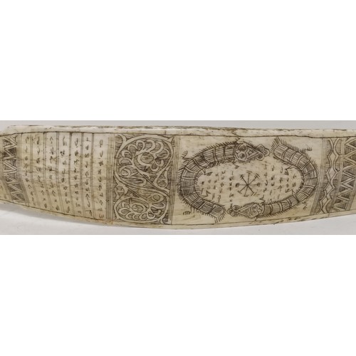 1147 - An Indonesian bone calendar, decorated reptiles, 40.5 cm wide