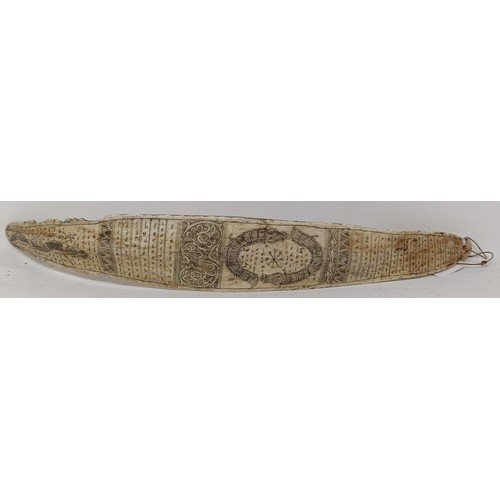 1147 - An Indonesian bone calendar, decorated reptiles, 40.5 cm wide